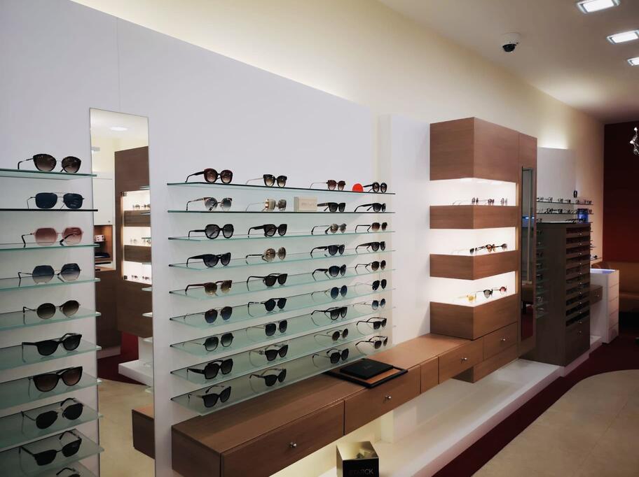 EyeVision by André Her | Frankfurt am Main (Hauptwache) interior featuring numerous pairs of sunglasses attractively arranged for customer viewing.